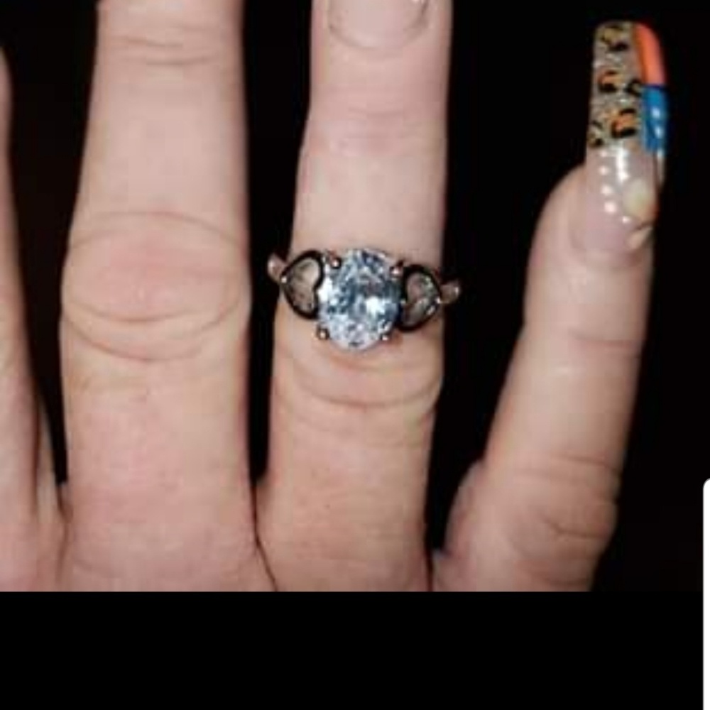 Silver diamond ring with hearts